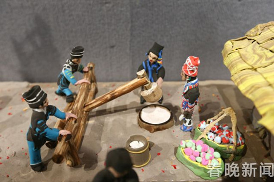 长达18米的大型千人面塑 还原云南人古风遗俗 长达18米的大型千人面塑 还原云南人古风遗俗