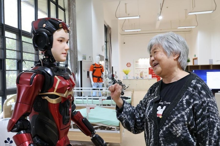 A senior resident interacts with "Xia Lan," a humanoid robot, at Shenzhen Nursing Home in Shenzhen, south China's Guangdong Province, March 3, 2025. (Xinhua/Liang Xu) A senior resident interacts with "Xia Lan," a humanoid robot, at Shenzhen Nursing Home in Shenzhen, south China's Guangdong Province, March 3, 2025. (Xinhua/Liang Xu)